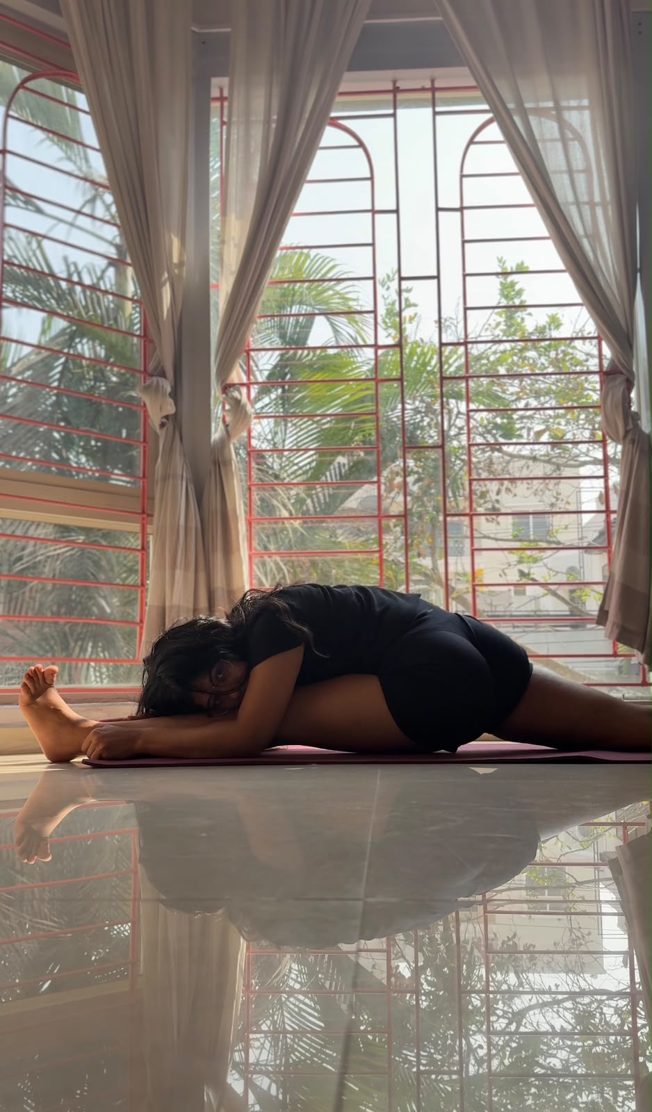 Shruti practising a forward fold